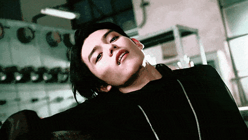 a close up of a person 's face with a piercing in their lip