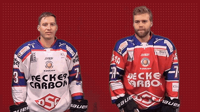 two hockey players wearing jerseys that say pecker carbon on them