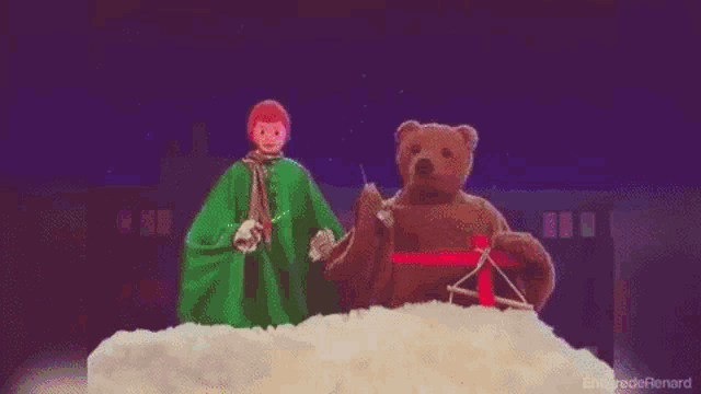 a teddy bear is holding a microphone in front of a rainbow background .