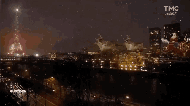 an aerial view of santa claus flying over a city with tmc night written on the bottom right