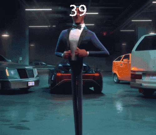 a man in a tuxedo is standing in front of a car with the number 39 on his face