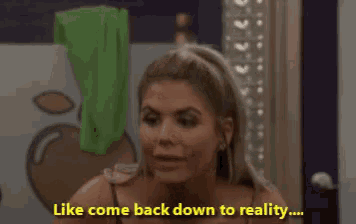 a woman says " like come back down to reality " in a bathroom
