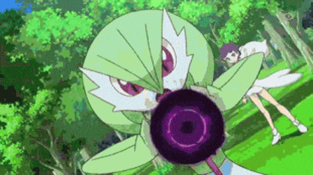 a green pokemon with a purple circle in its mouth