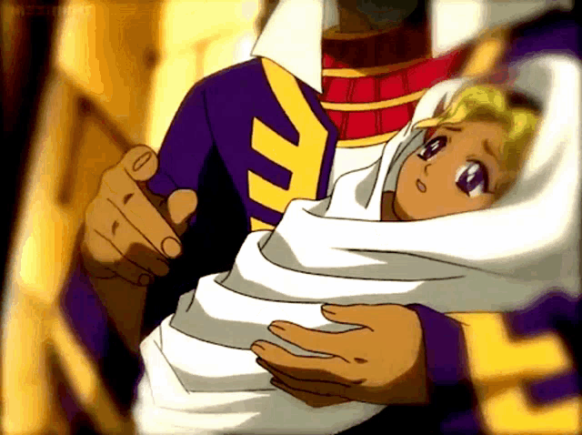 a man is holding a baby wrapped in a white blanket with a purple shirt on
