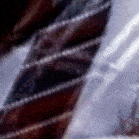 a close up of a striped tie with a white stripe on the bottom