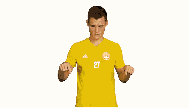 a soccer player wearing a yellow jersey with the number 27 on it