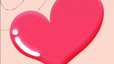 a close up of a cartoon character with a heart on his nose and a smile on his face .
