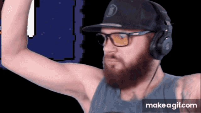a man with a beard wearing headphones and a hat that says ' nintendo ' on it