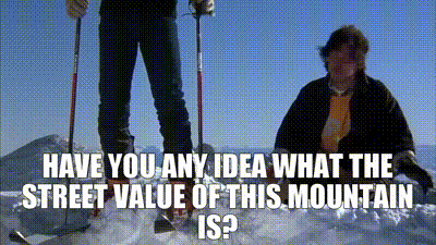 two people skiing on top of a snow covered mountain with the words " have you any idea what the street value of this mountain is " below them