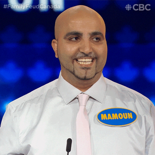 a man with a name tag that says mamoun