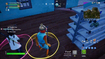 a man is playing a video game while holding a hula hoop and a gun .