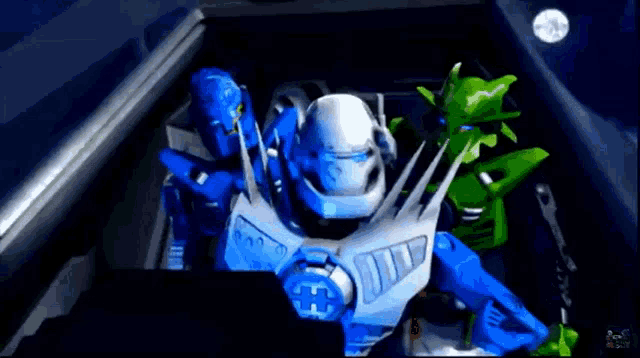 a blue robot and a green robot are sitting in a dark room