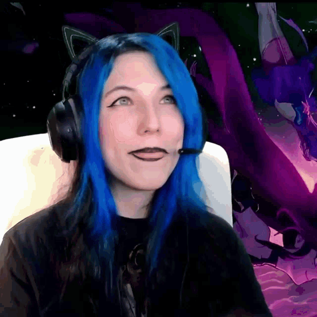 a girl with blue hair wearing headphones and a microphone