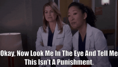 two female doctors sitting next to each other with a caption that says okay