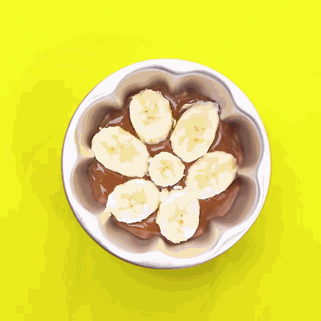 a bowl of food with banana slices on top