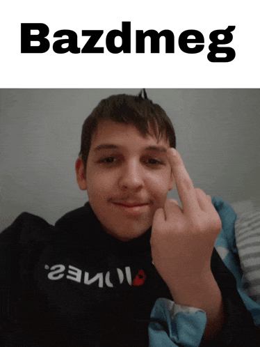 a boy giving the middle finger with the word bazdmeg on the bottom