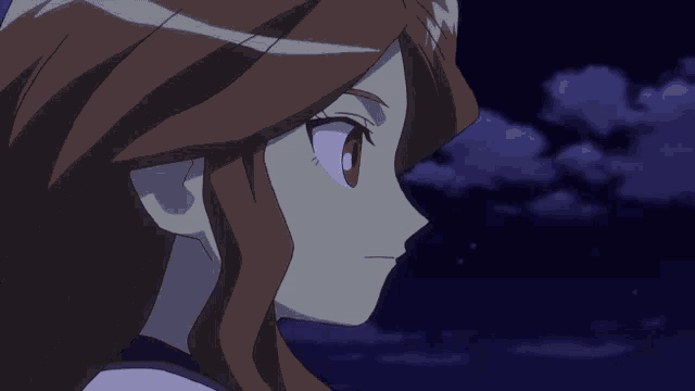 a close up of a girl 's face with a cloudy sky behind her