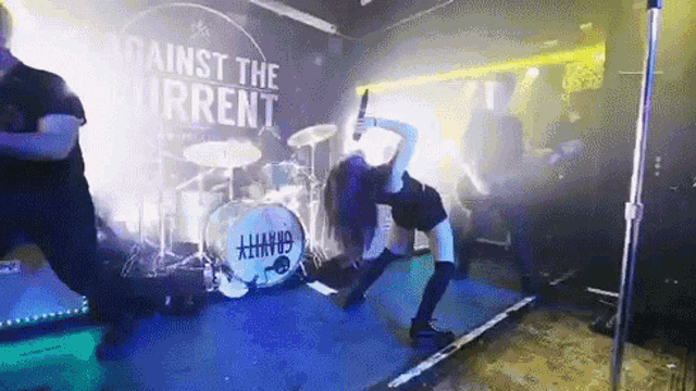 a band called against the current is playing on stage