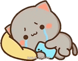 a cartoon cat is laying on a pillow and crying while holding a bottle of water .