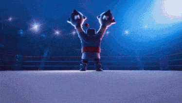 a cartoon character in a boxing ring with his hands in the air