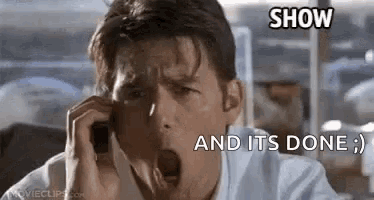 a man is yawning while talking on a cell phone and it is done .