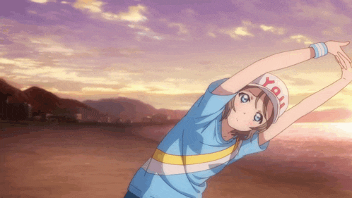 a girl wearing a blue shirt and a hat with the word you on it