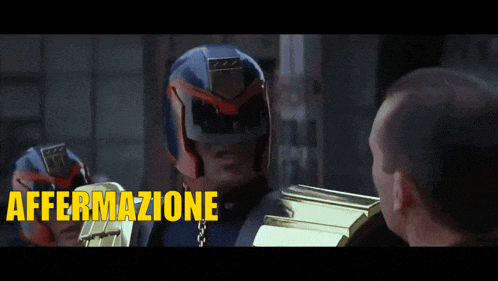 a man in a helmet is talking to another man with the words affermazione prevedibile written in yellow