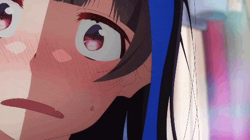 a close up of a girl 's face with a tear coming out of her eye