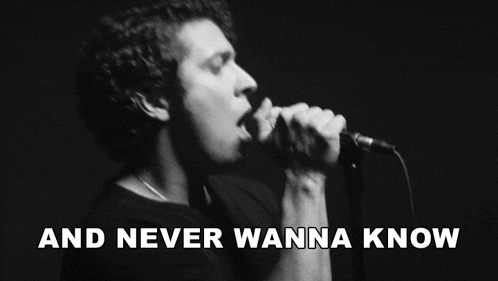 a black and white photo of a man singing into a microphone with the words and never wanna know below him