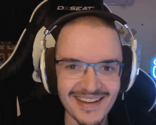 a man wearing headphones with a d seat logo on the back of his chair