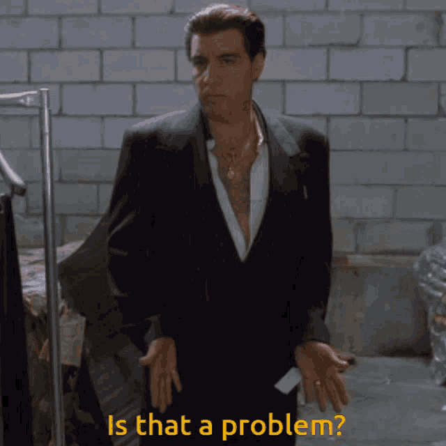 a man in a suit with the words is that a problem behind him