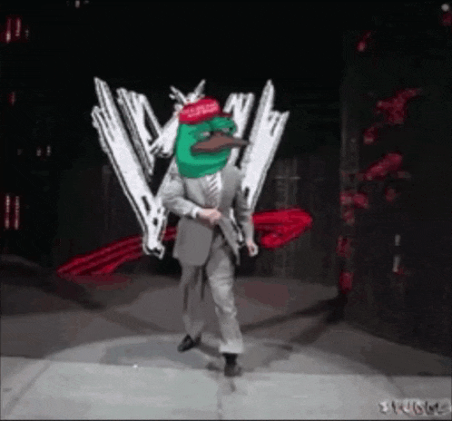 a man in a suit and tie is dancing in front of a w logo