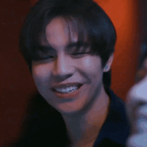 a close up of a person 's face with a smile on it