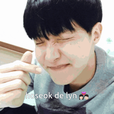 a close up of a person 's face with the words " hoseok de lyn " above it