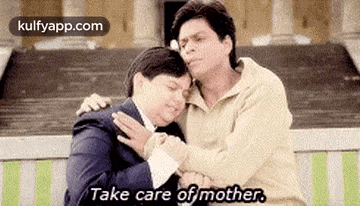 a man is hugging another man and says `` take care of mother . ''