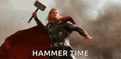 thor is holding a hammer in his hand while wearing a red cape .