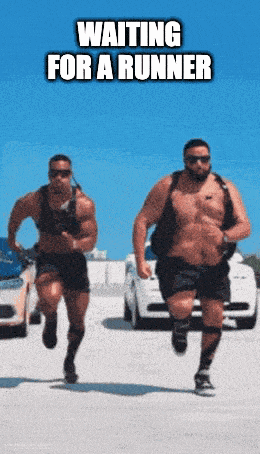 two men are running in a parking lot with the words waiting for a runner on the bottom