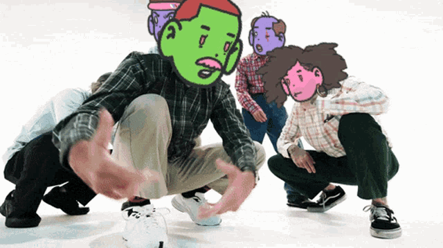 a group of people are squatting down with cartoon faces on their heads