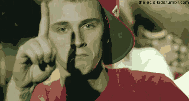 a pixelated image of a man 's face with the website the-acid-kids.tumblr.com at the bottom