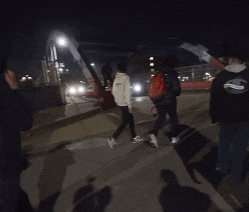 a blurry photo of a man wearing a hood