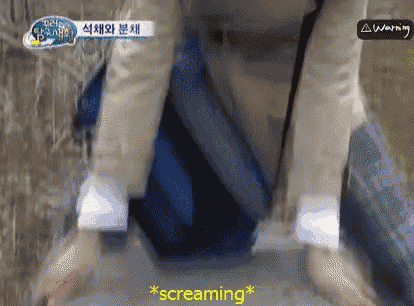 a person is kneeling down and screaming in a video