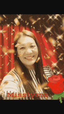 a woman is smiling in front of a red curtain with the name misslynn on the bottom