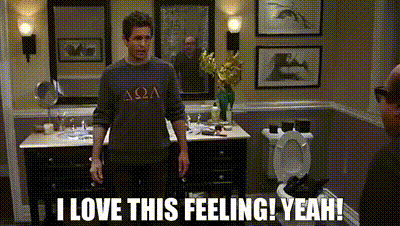 a man standing in a bathroom with the words " i love this feeling yeah " on the bottom
