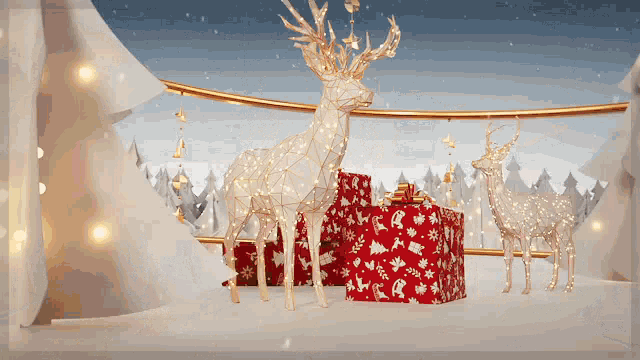 a christmas scene with reindeer and presents on a snowy surface
