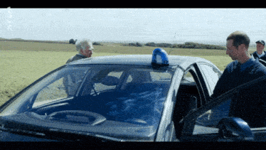 a police car with a blue light on top