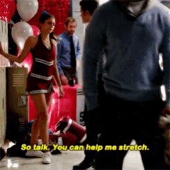 a cheerleader says so talk you can help me stretch in front of a group of people