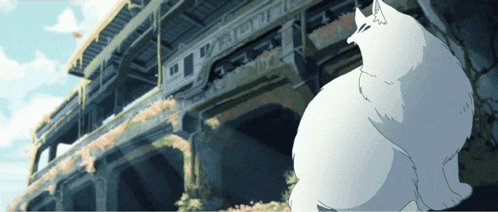 a white cat is sitting in front of a building that says ' tokyo ' on the side