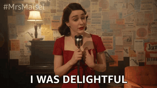 a woman singing into a microphone with the words " i was delightful " next to her