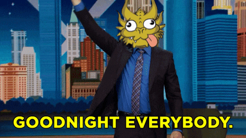 a man in a suit and tie says goodnight everybody in front of a city skyline