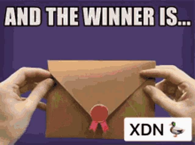 someone is holding an envelope with a red ribbon and the words and the winner is